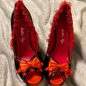 Women’s red and black 4inch heels. Size 10